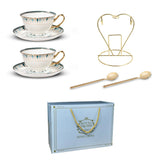 Tea cups and saucers with gold trim, a decorative stand, spoons, and a 'Royal LoQueen' branded box on a white background.