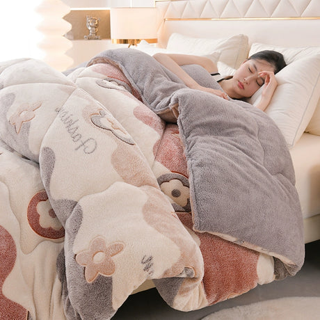Person lying on a bed under a floral-patterned blanket with cartoon characters.