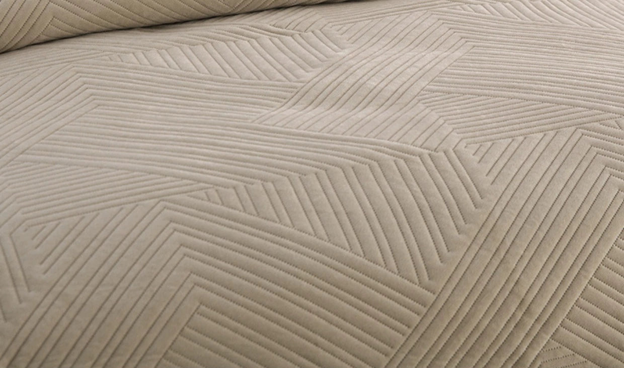 Textured beige fabric with a geometric pattern