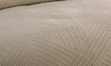 Textured beige fabric with a geometric pattern