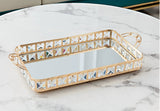 Decorative tray with crystal embellishments on a marble surface
