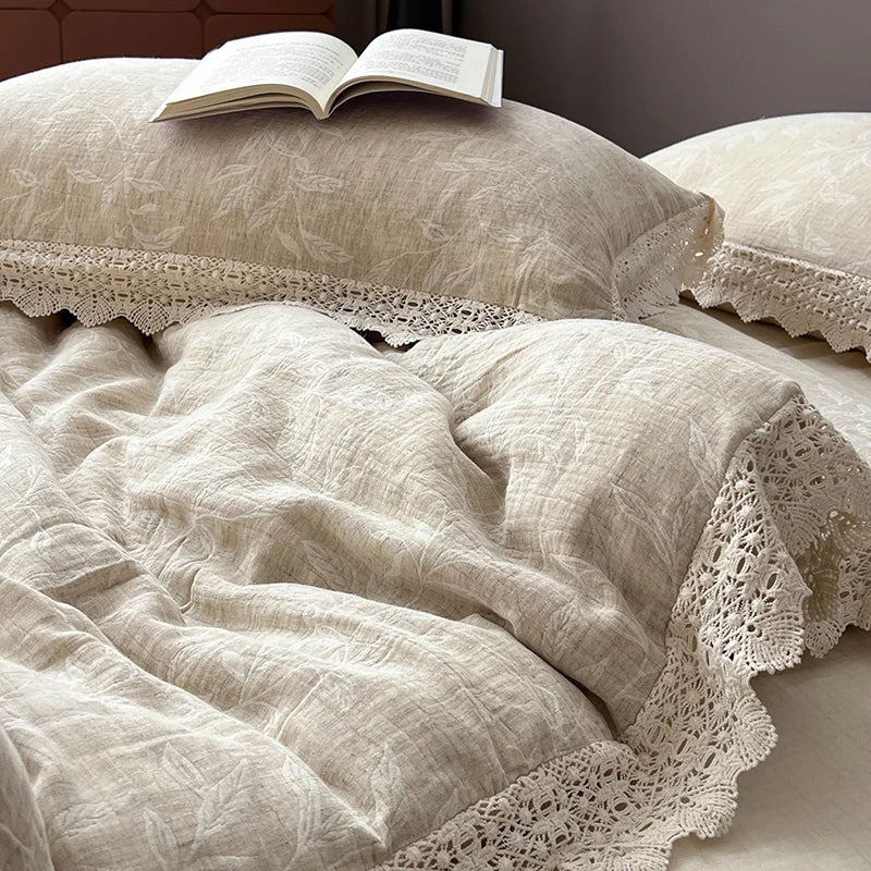 Textured beige bedding with lace trim and an open book on a pillow.