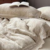 Textured beige bedding with lace trim and an open book on a pillow.