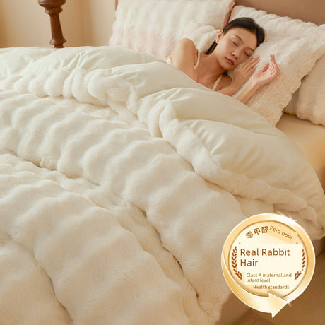 Person sleeping under a fluffy white comforter with a 'Real Rabbit Hair' label in the corner.