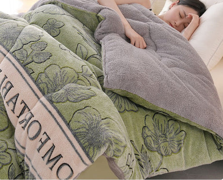 Person sleeping under a floral-patterned blanket with 'OMAR' branding.