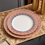 Set of decorative plates with geometric pattern on a textured surface