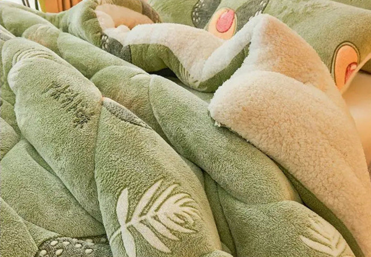 Green textured blanket with leaf pattern on a soft background