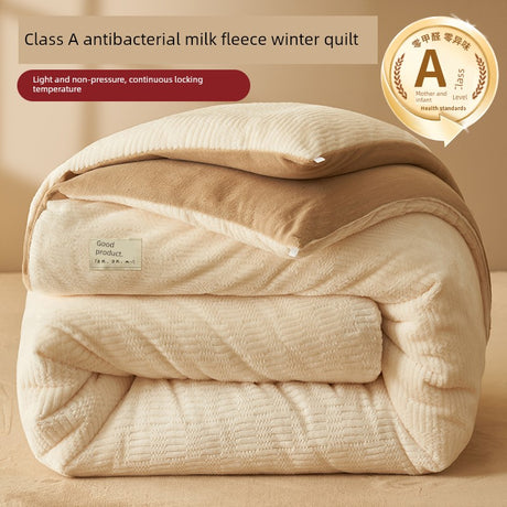 Beige quilt with Class A antibacterial milk fleece label on a beige background