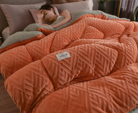 Person sleeping under a patterned orange comforter with a 'Rapid delivery' label above.