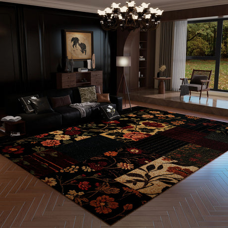 Living room with a floral-patterned rug, dark walls, and large windows.