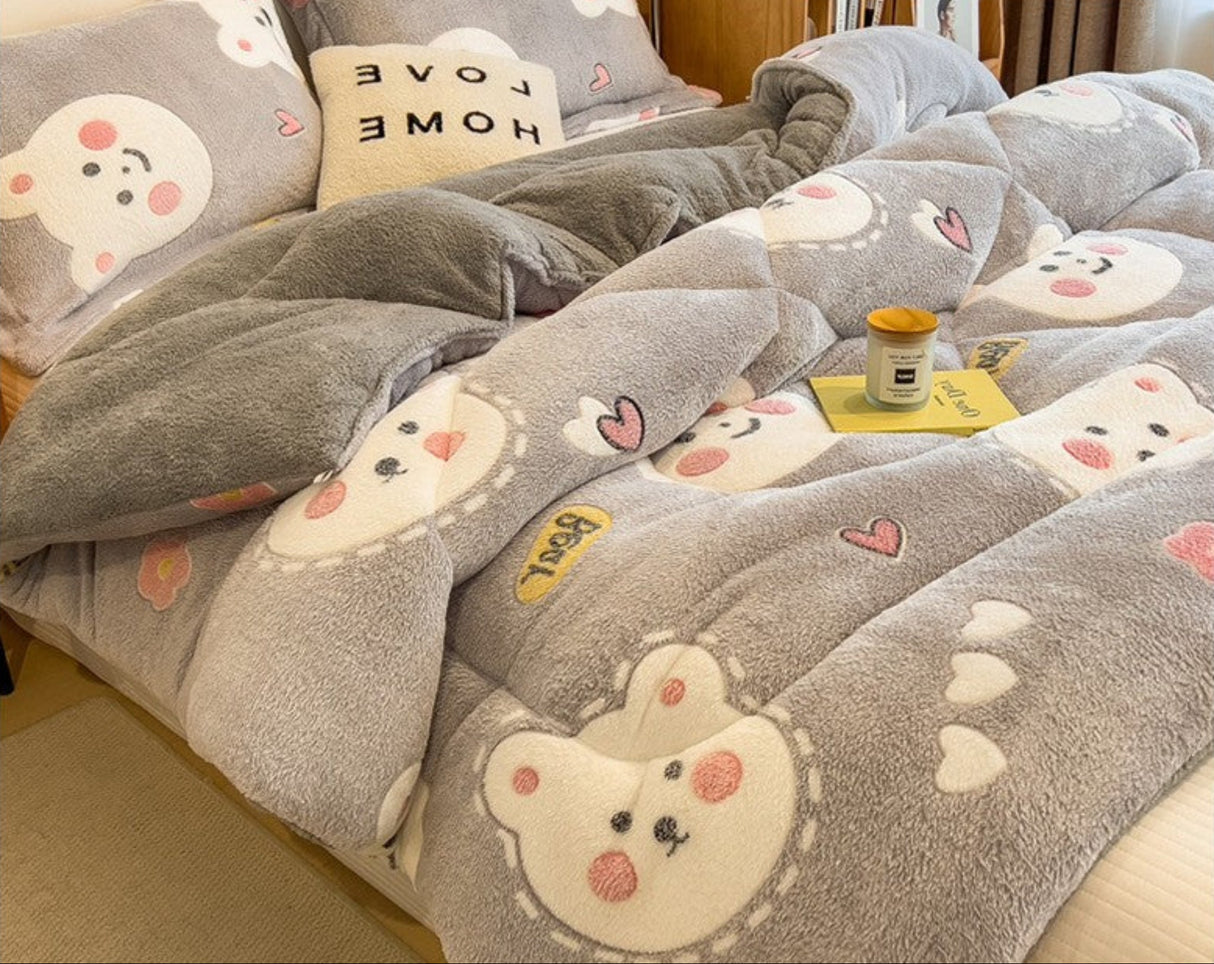 Fluffy blanket with cartoon bear design on a bed, featuring rapid delivery text.