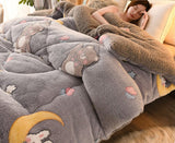 Person lying on a bed under a gray cartoon-themed comforter with a 'Rapid delivery' label above.