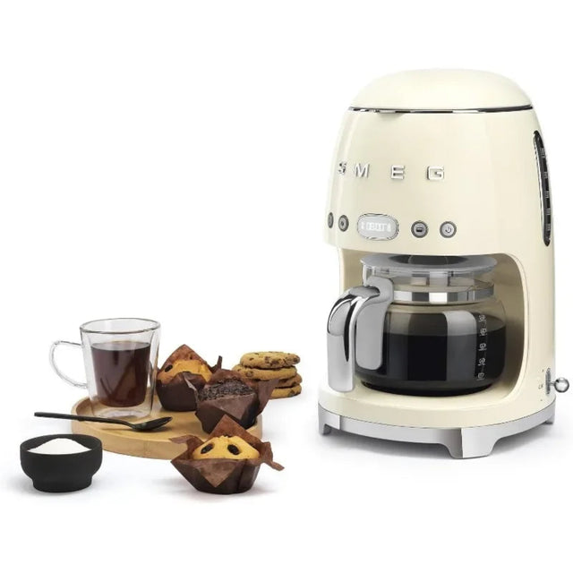 Cream-colored coffee machine with a cup of coffee and cookies on a white background