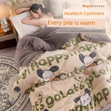 Woman lying on a bed with cartoon-themed bedding and text 'Every pile is warm' and 'Heattech Cashmere'.