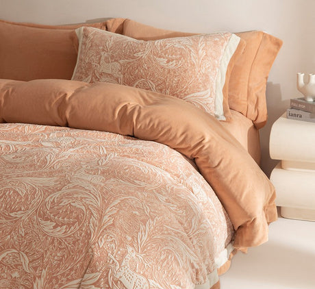 Patterned bedding set on a bed with a neutral background