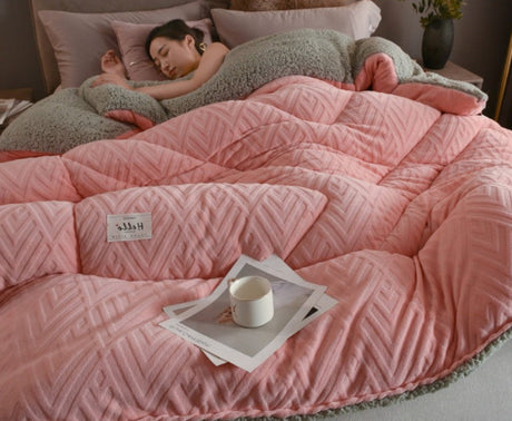 Pink quilted blanket on a bed with a person underneath, featuring product details and a 'Rapid delivery' label.