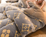 Fluffy gray and beige patterned blanket on a bed with a person holding it, and 'Rapid delivery' logo.
