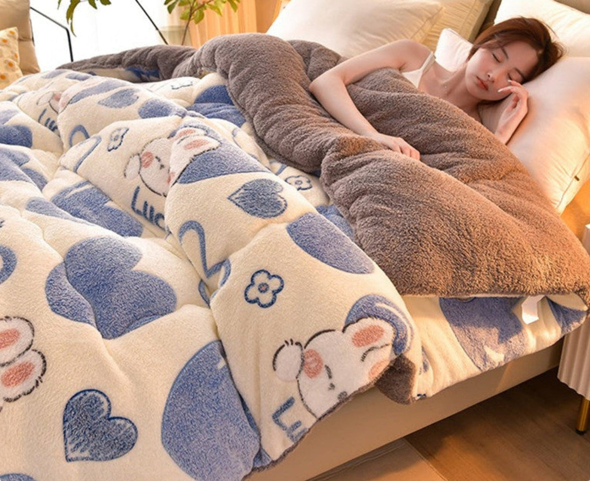 Person lying on a bed with a cartoon-themed blanket and pillow