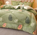 Green textured blanket with leaf patterns on a bed, featuring text about the product.