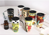 Set of colorful mugs with various designs on a white surface