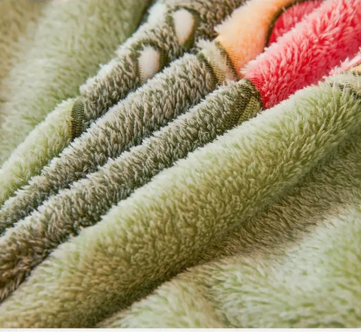 Close-up of fluffy fabric with a brand logo on a beige background
