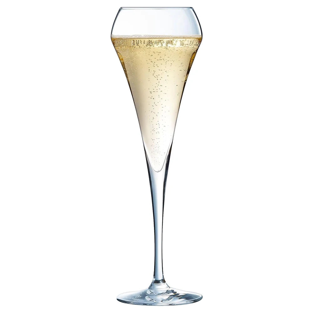 Champagne flute with sparkling wine on a white background