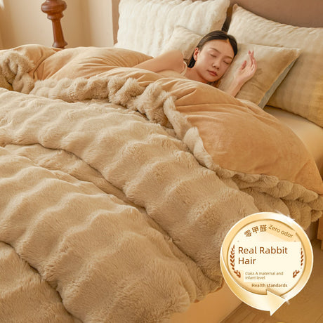 Woman sleeping under a fluffy beige comforter with a label indicating 'Real Rabbit Hair'.