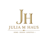 A gold-toned logo featuring the initials 'JH' above the text 'JULIA M HAUS' and the tagline 'HOME • DESIGN • LIFESTYLE', centered on a plain white background.