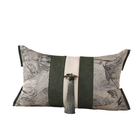 Decorative pillow with geometric pattern and tassel on a white background