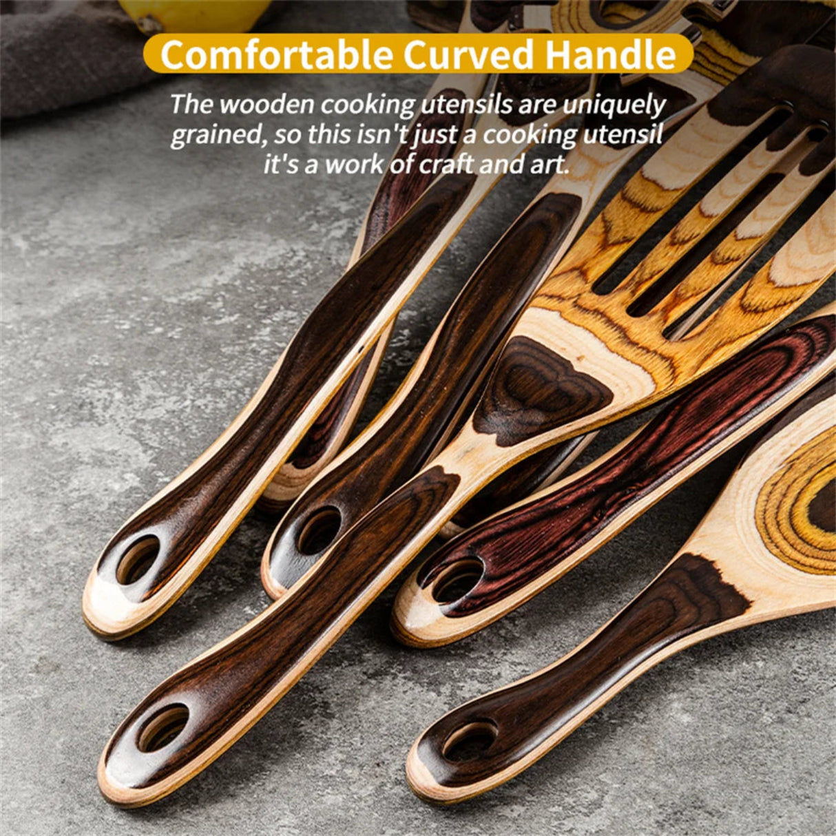 Set of wooden cooking utensils with a comfortable curved handle on a gray surface.