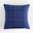 Blue textured pillow on a white background