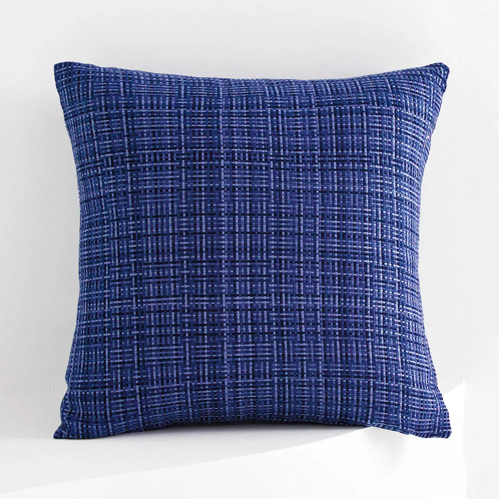 Blue textured pillow on a white background