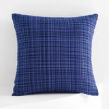 Blue textured pillow on a white background