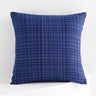 Blue textured pillow on a white background