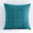 Teal textured pillow on a white background