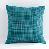 Teal textured pillow on a white background