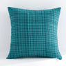 Teal textured pillow on a white background