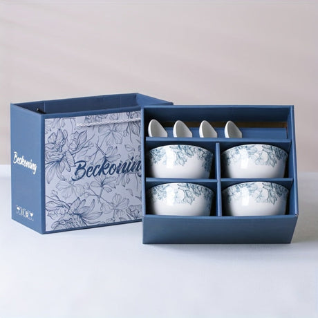Set of four white ceramic bowls with floral patterns in a blue decorative box, featuring the brand 'Beckoning'.