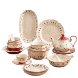 Ceramic dinnerware set with floral patterns on a white background