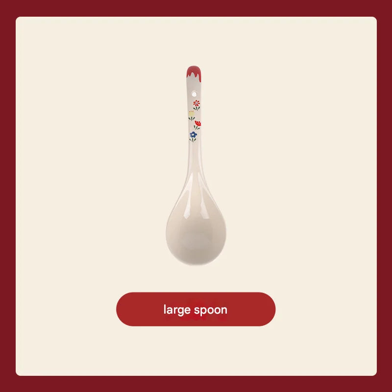 White ceramic spoon with floral design on a beige background