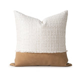 Pillow with textured white top and brown bottom on a white background